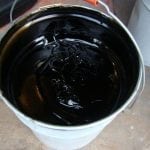 Bitumen primer in a bucket