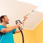 Painting the ceiling with a spray gun