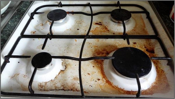 Soot on an enameled surface of a gas stove