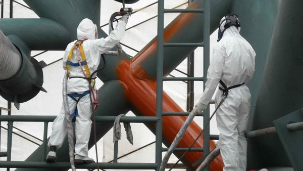 Application of a chemical-resistant primer with a spray gun