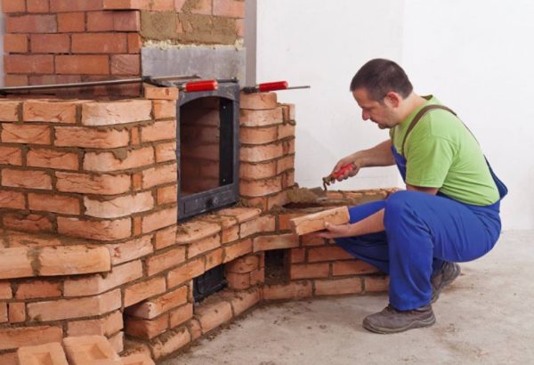 Heat-resistant composition is used in the construction of the fireplace
