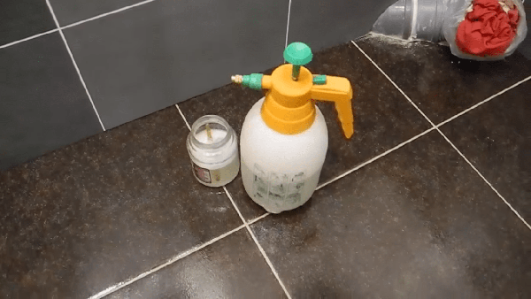 Using a spray gun to apply a soap solution