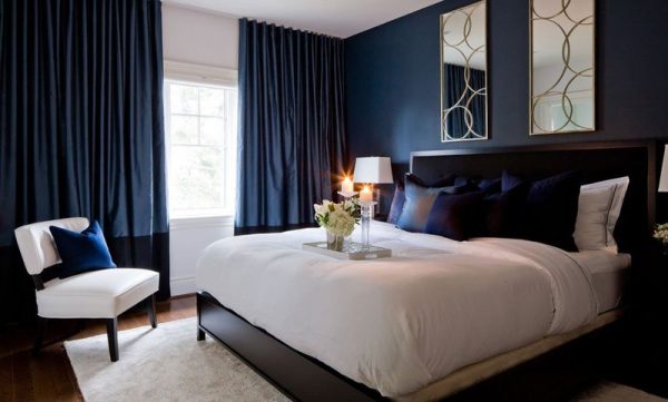 The interior of the bedroom in dark blue tones