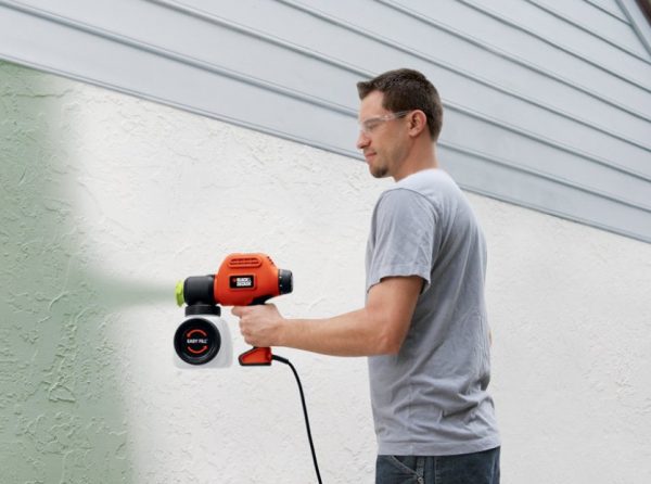 Painting the walls with a spray gun