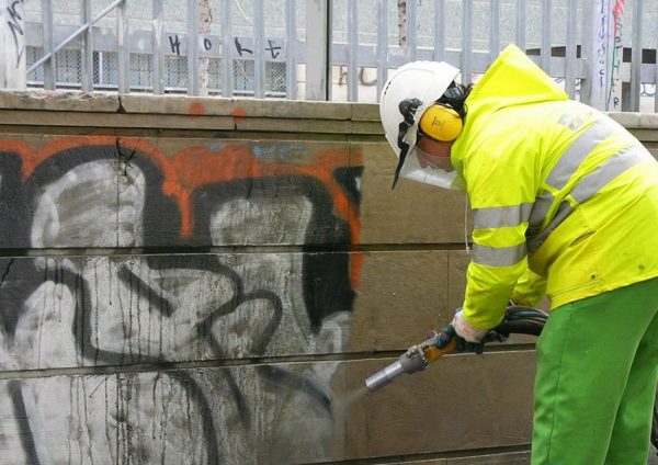 Removing graffiti from the wall