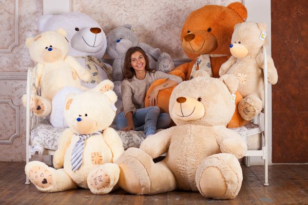 Girl surrounded by teddy bears