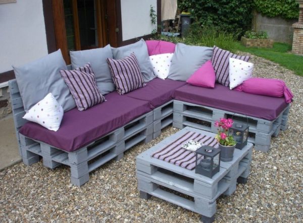 Painted corner sofa from pallets in the country
