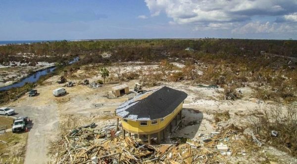 A round stilt house that stands after a hurricane