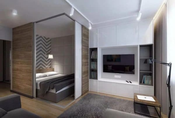 Bedroom in the niche of a studio apartment
