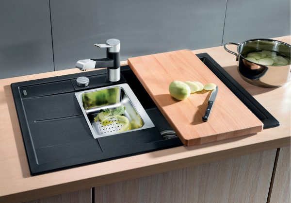 Kitchen sink with cutting board