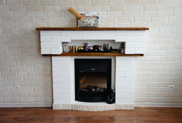 Homemade portal for a fireplace under a brick