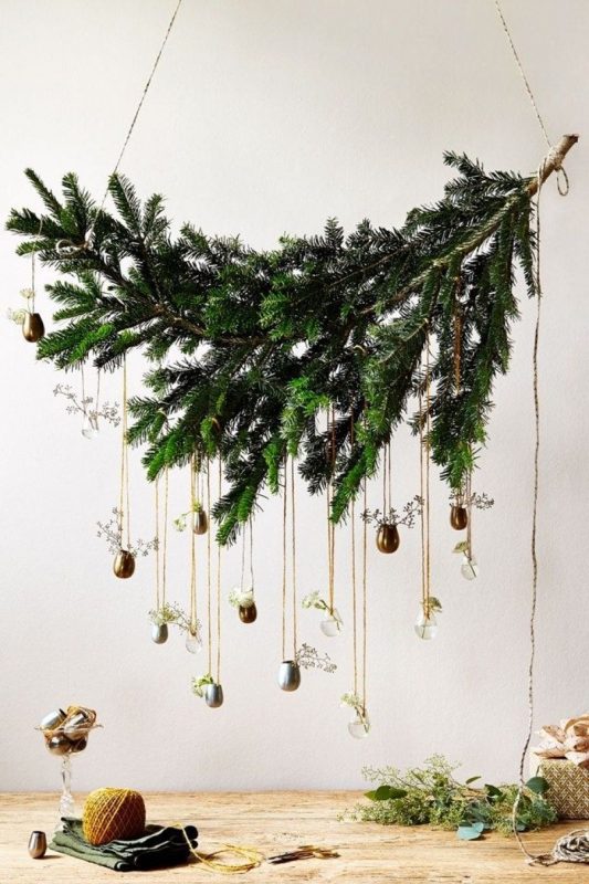 Christmas tree of coniferous branches on the wall