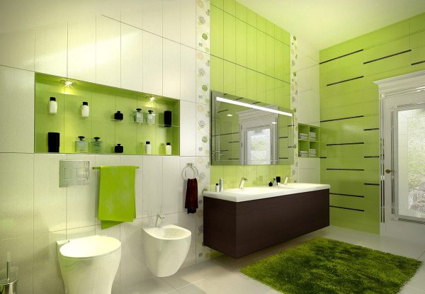 El uso de tonos verdes en el diseño del baño.