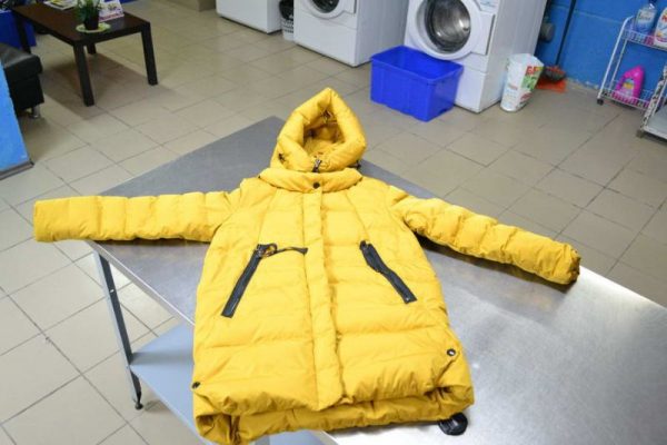Yellow down jacket on the table
