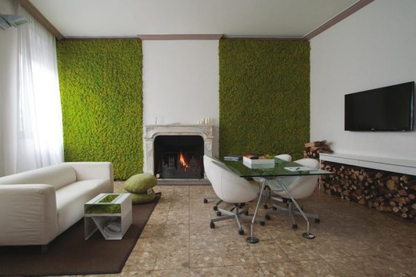 Artificial grass on the wall in the living room interior