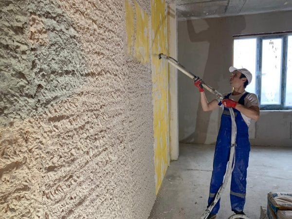 Plastering by mechanized machines